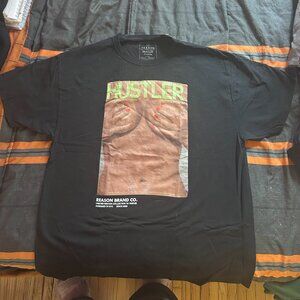 Black tshirt with Hustler magazine cover on it